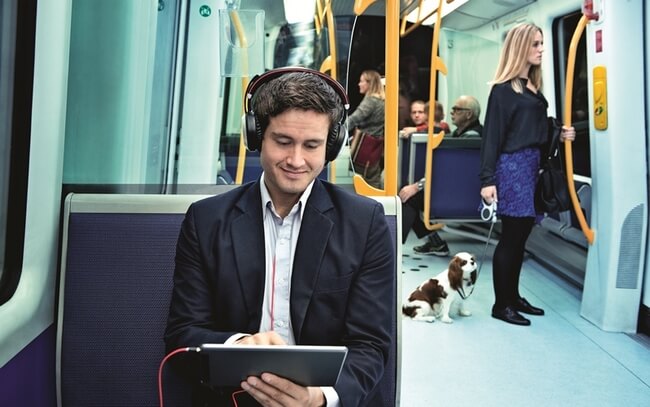 Man-wearing-Evolve-80-with-active-noise-cancellation-in-the-metro.jpg